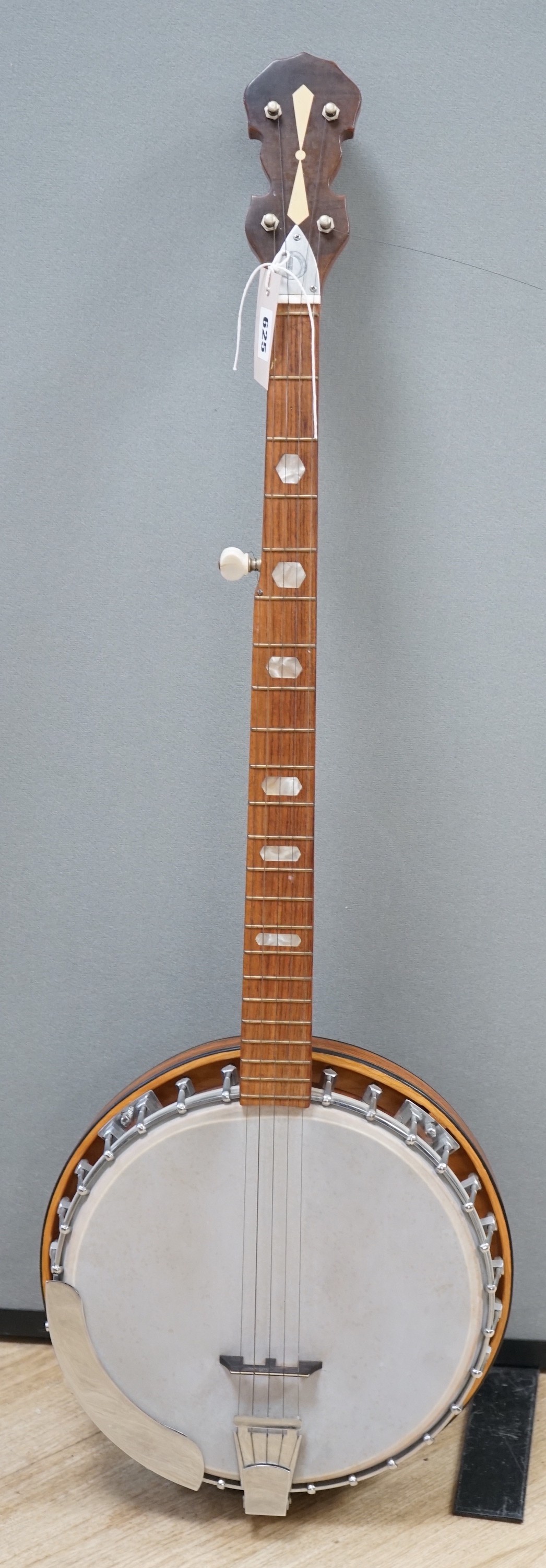 A five string banjo made by John Degay of Degay Guitars